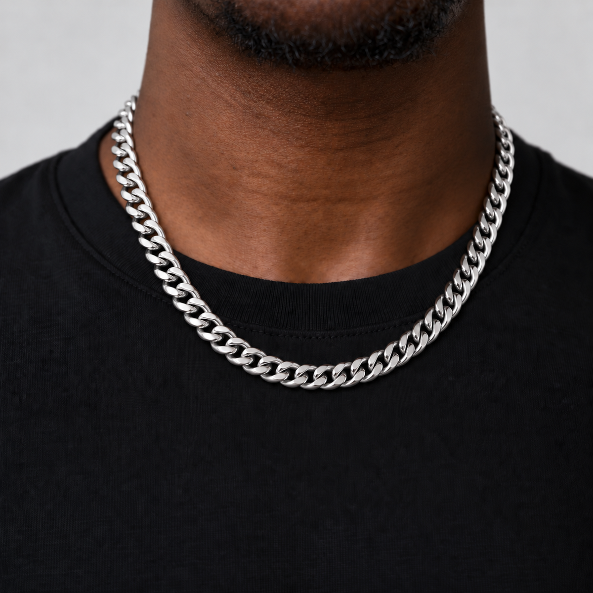 8mm silver Cuban chain, black tee studio, Unveiled website product photograph.