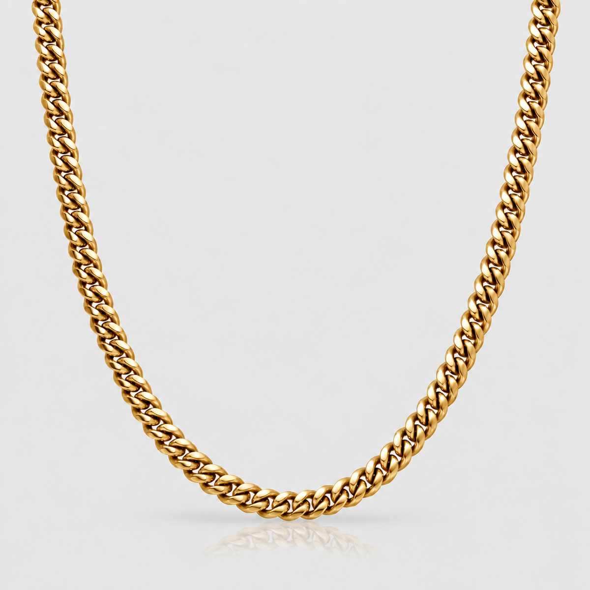 6mm 18k PVD gold Cuban chain on Unveiled light-grey background, standalone product photograph.