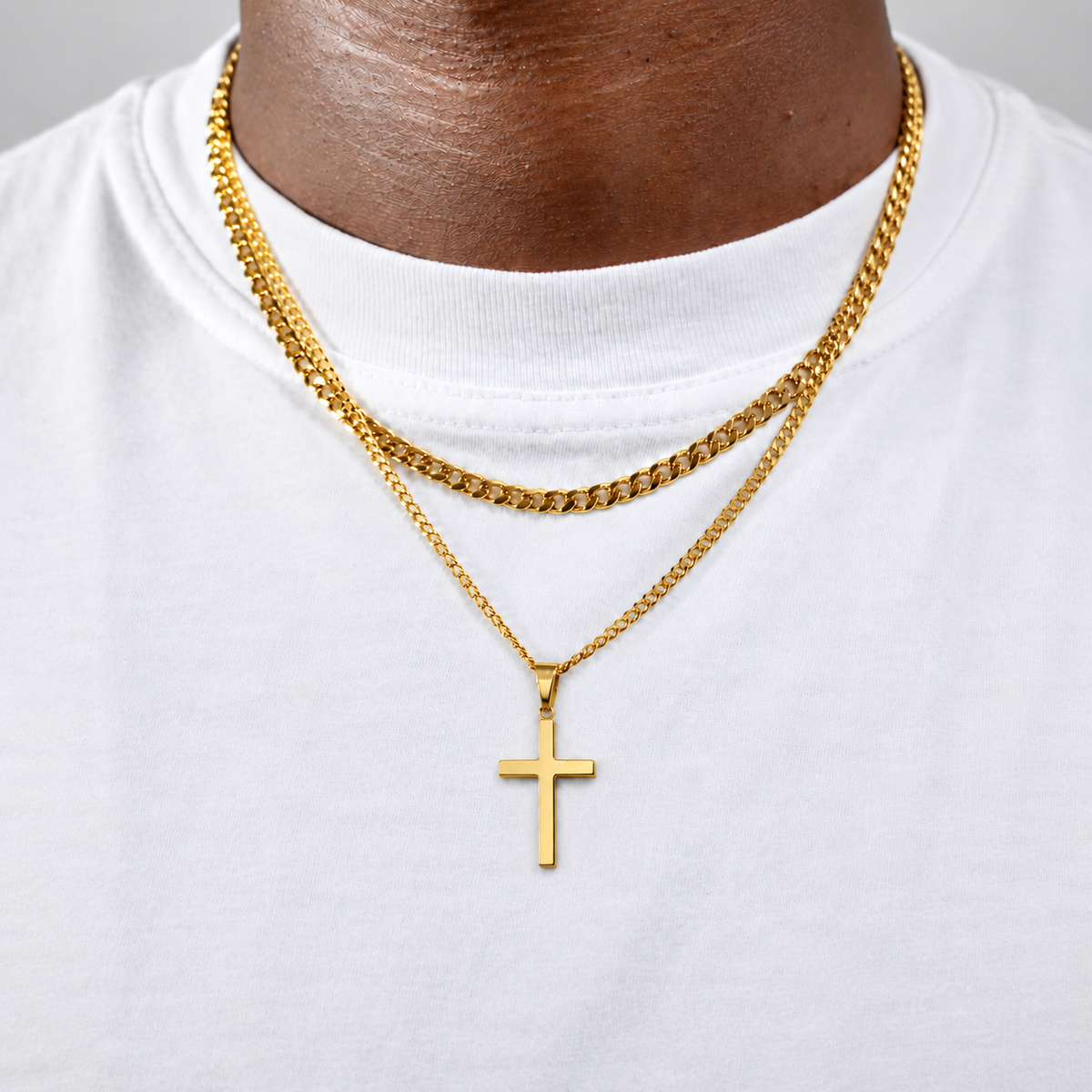 His Cross in 18k PVD gold layered on a white tee, square photograph