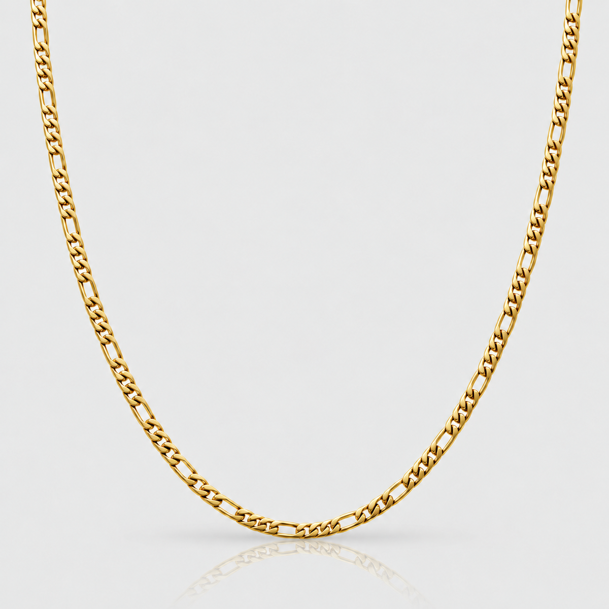 Unveiled 3mm Figaro chain, 18k PVD gold, Light-grey packshot
