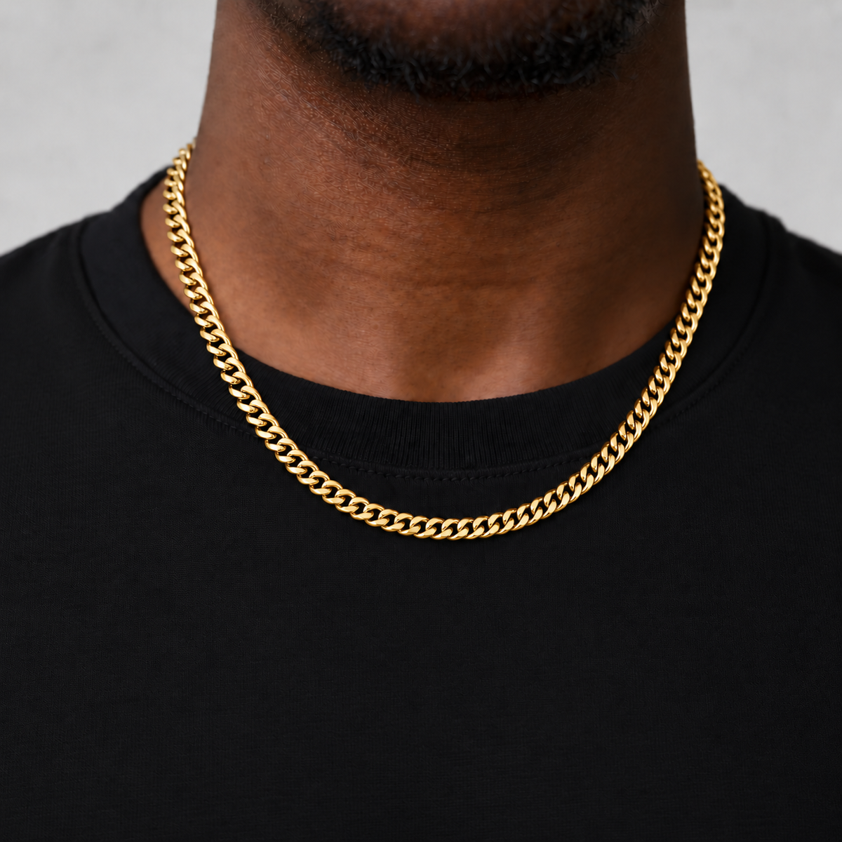6mm 18k PVD gold Cuban chain, 50cm, black fine-cotton tee model photograph.