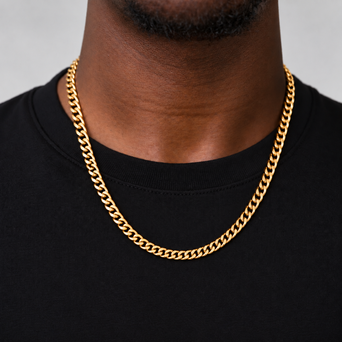 6mm 18k PVD gold Cuban chain, 55cm, black tee model photograph