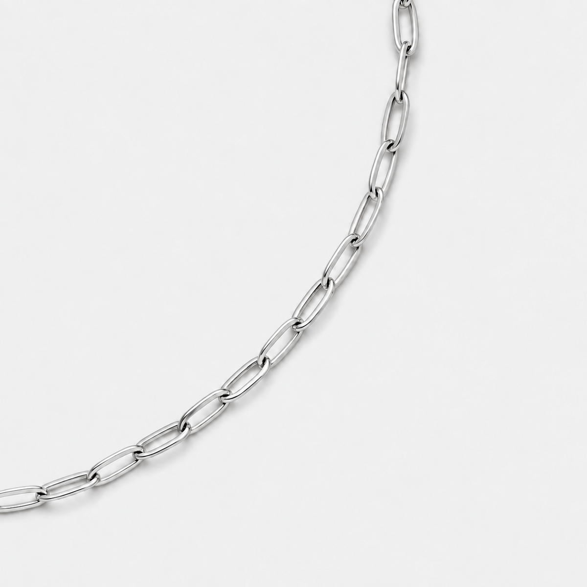 Paperclip Chain silver polished link detail on light grey background