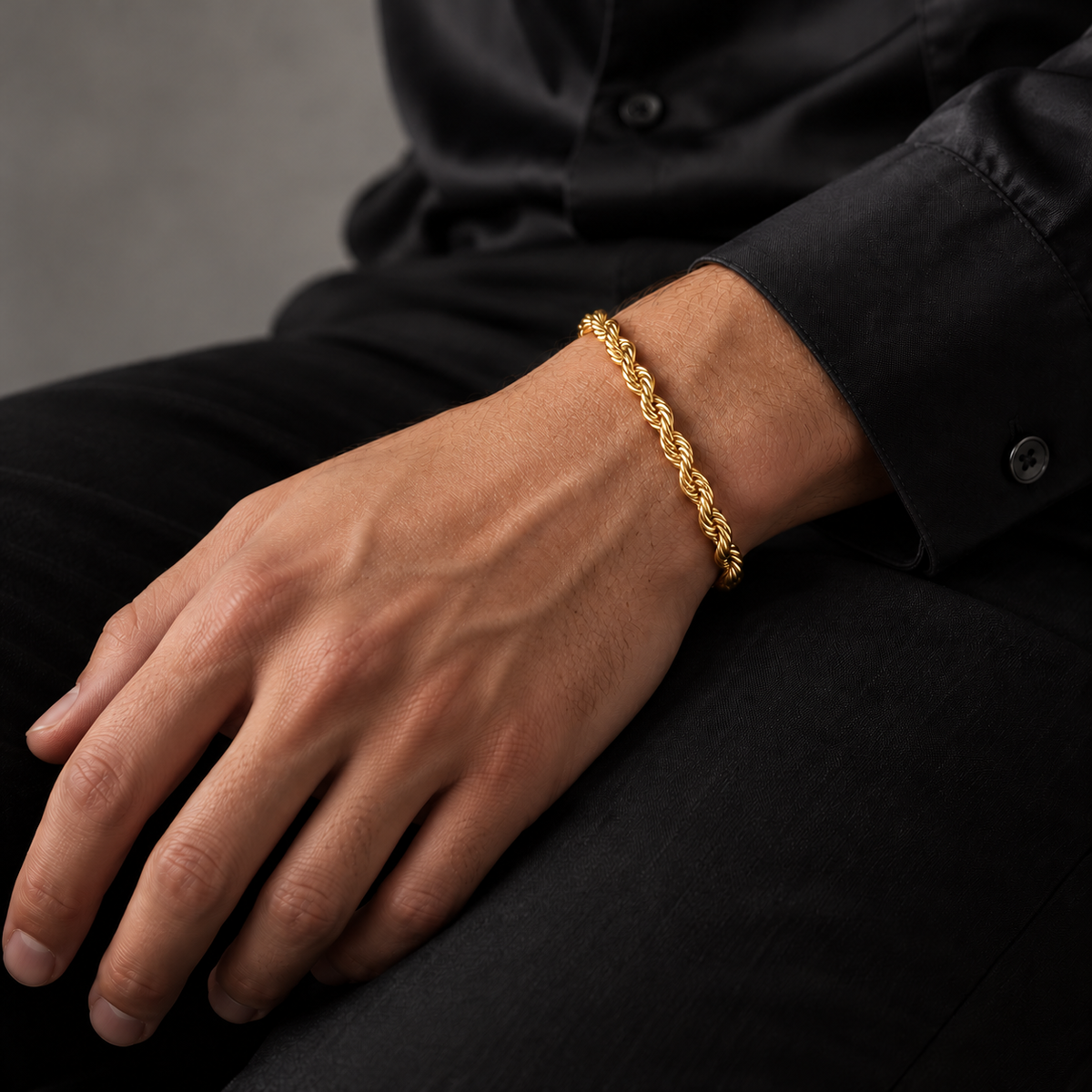 Gold 5mm rope bracelet, seated model photo