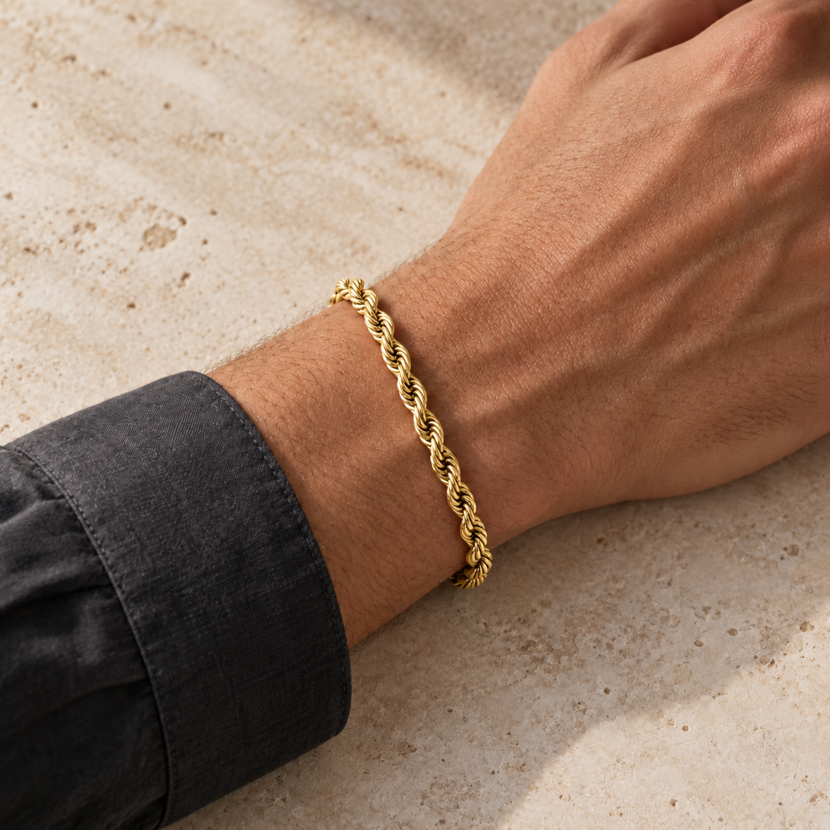 Gold 5mm rope bracelet, charcoal model photo